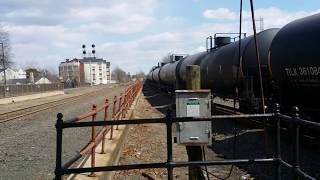 BNSF tanker train with CREX Citirail locomotive Passing Bound Brook