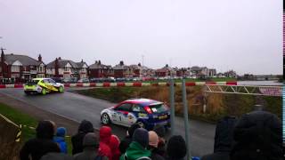 Arron Newby in a Subaru Impreza followed by Tony Bardy in a Ford Focus WRC