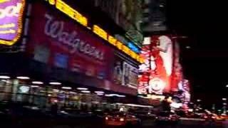 Times Square in New York City Manhatten at night with lights