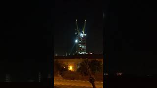 Crane lifting an item on top of tall building !