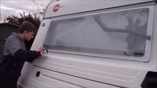 caravan window being replaced and water draining from old window