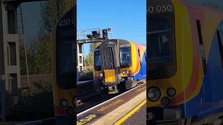 Class 450s pull into Clapham Junction