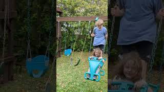 Seamus and Caden on the horse swing