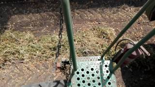 John Deere W650 unloading white bean in Volvo F12 truck