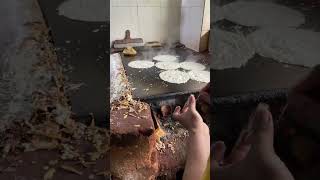 Desi white ghee dosa making with burning coconut shells