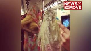 Women dancing in Delhi Metro