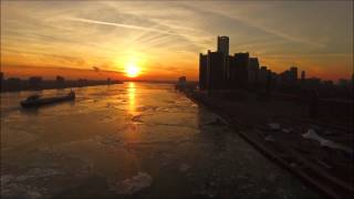 Drone over Detroit River at sunset