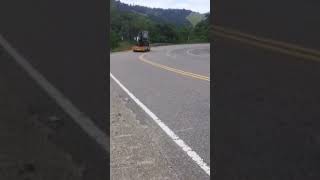 Excavator Truck Passing Sharp Downhill Turns on Extreme Track