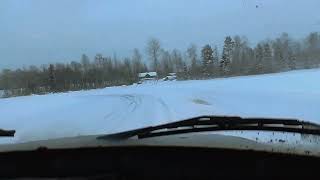 Volvo 240 with spike tires on frozen lake