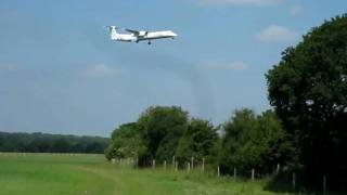 Flybe Dash 8-400 on short final at London-Gatwick Airport