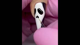 Halloween ghost face nail art