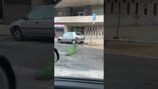 Peacock in the street of Lisbon