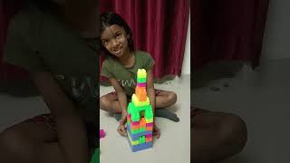 Irene making castle with blocks