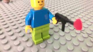 lego man shoots a gun