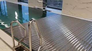 We installed and are testing the automatic pool cover in the home spa center's stainless steel pool