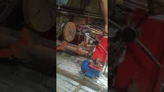 Man making hole in pipe.