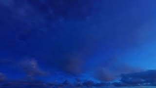 ( CGI 4k Stock Footage ) Dark blue night clouds on stary sky time lapse seamless loop