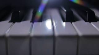 Piano keys on a dark background in motion