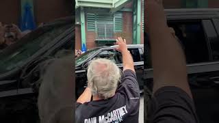 Paul McCartney driving into Fenway Park