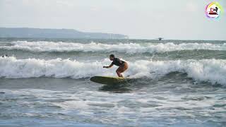 Handheld Wide Shot Tracking Surfer Riding Wave