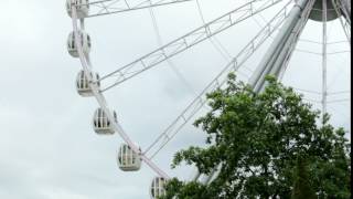 Ferris wheel attraction in slow motion rotating circle Park