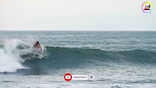 Handheld Long Shot of Surfer Riding a Wave