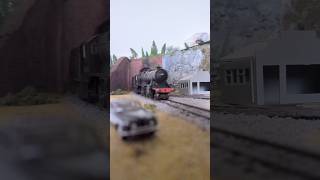 The officialhornby 8f emerges from the tunnel with a load of coal on the waterfall mine line #train