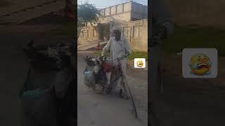 An old man is selling rice on a bicycle..