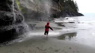 Nic runs through Mystic Beach Waterfall.MOV