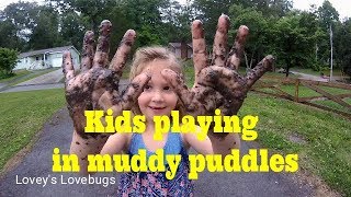 kids playing in muddy puddles