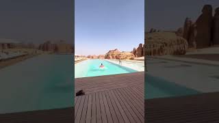 Swimming Pool view of Habitas AlUla Hotel in Saudi Arabia | Men Diving into it