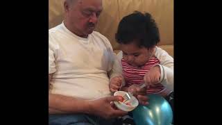 Funny baby video l Baby is feeding Papaya to grandpa