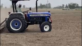 New Holland 5620 with 15 cultivator