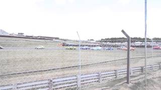 Bernie's Classic V8 Muscle Cars going through Graham Hill Bend Safety Car