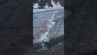 The waters descending from the great glacier