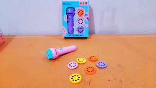 Unboxing and Review of Mini Projector 6 Slids 48 Patterns Flashlight Torch Kids Projection Light Toy