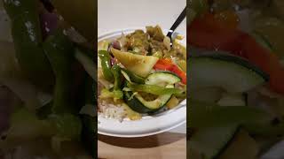 Curry lamb and mix vegetables serve with white rice.