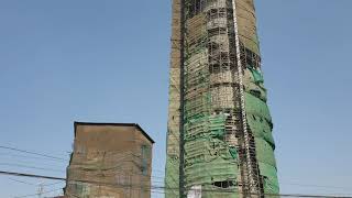 New Dharahara tower is being built and Old Dharahara tower looks so tiny in front of that.