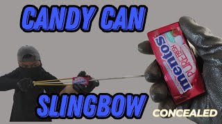 Slingbow  candy tin can