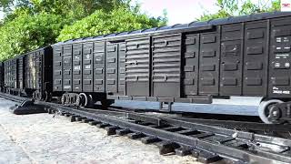 Very Long Freight Wagons With Sliding Sides Pulling By HO Scale Model Train