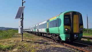 Class 377s pass Tide Mills Foot Crossing