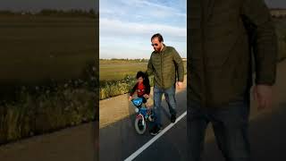 Escape the fear: Daddy teaching his child how to ride a bike fearlessly without training wheels