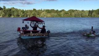 Tubing behind the Twisted Tea Picnic Table Boat