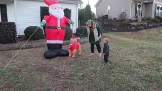 Toddler doesn't TRUST blow up SANTA!! #SHORTS