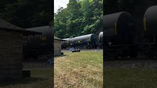 A Norfolk Southern train of tank cars descends Horseshoe Curve near Altoona, PA.