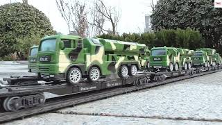 Toy Train Pulling Massive Military Trucks Missile Truck Fleet Crash On HO Scale Model Train Railroad