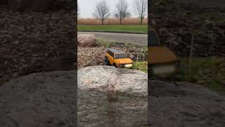 TRX 4 climbing over big rock #shorts #traxxas #rccar #trx4 #fordbronco