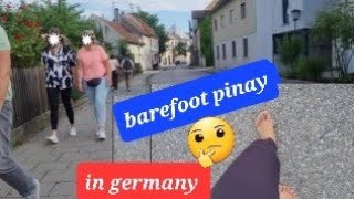 barefoot filipina in the street of Germany