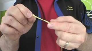 Cutting a yo-yo string to the correct length.