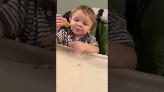 Caden eating Broccoli